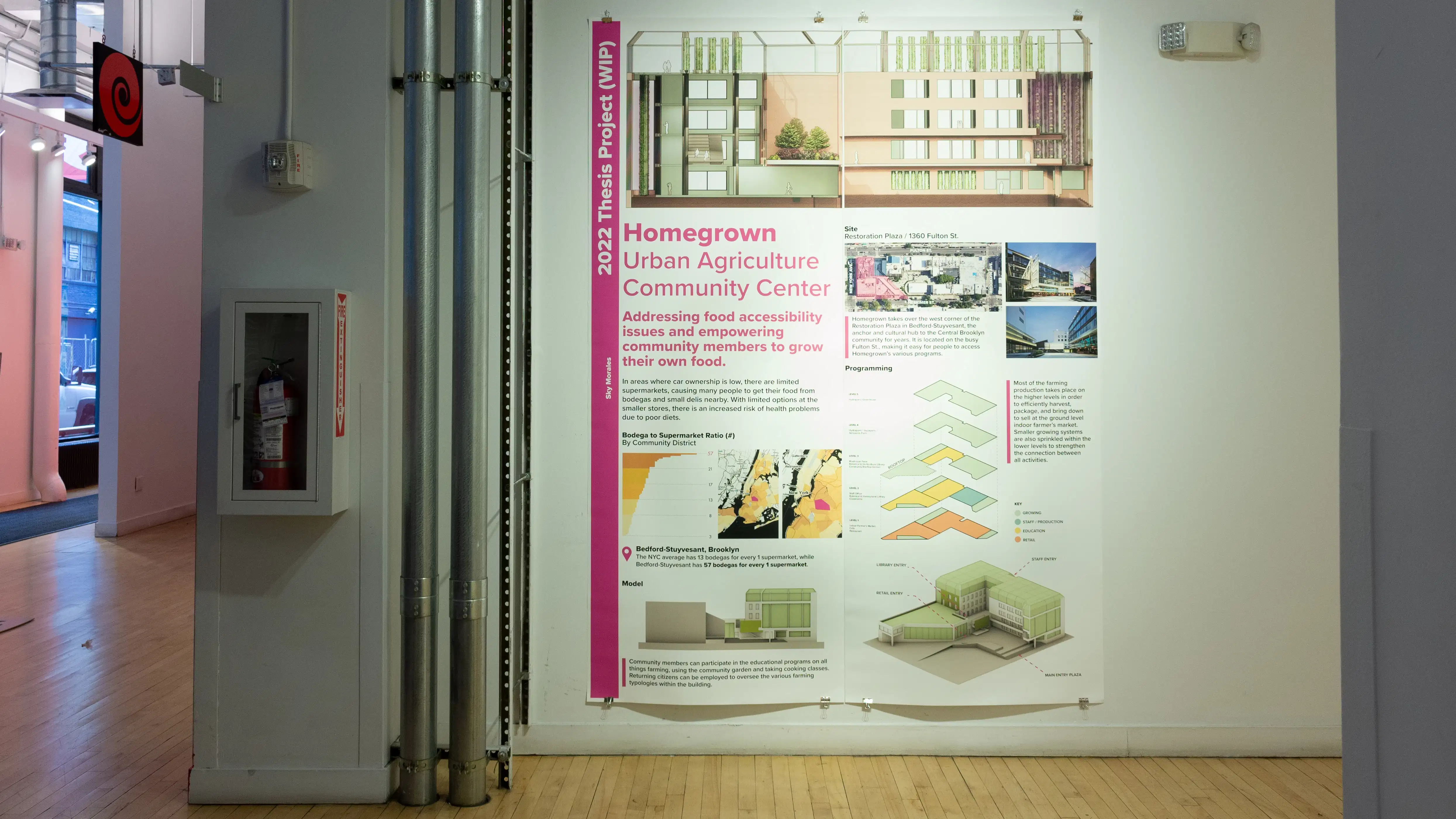 Exhibition view of An Infrastructure for Restorative Justice, featuring hallway with a large poster on the wall.