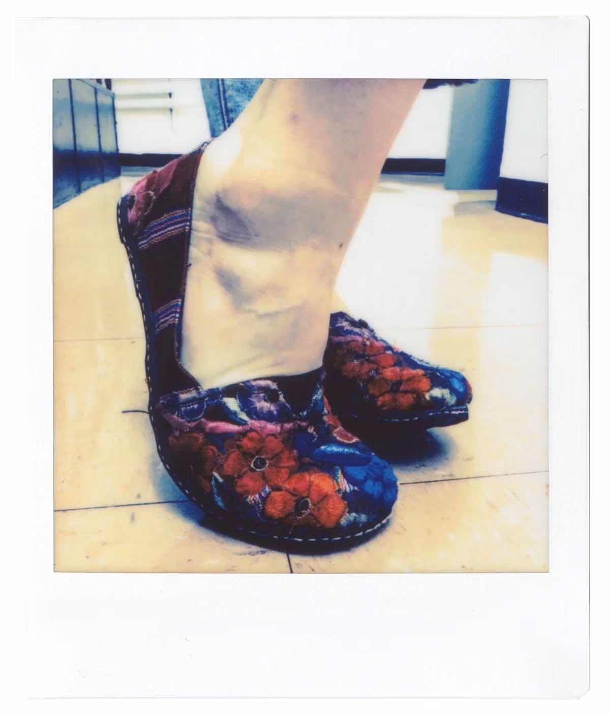 The shoes have flowers and stripes.
