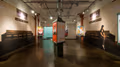 Photograph from inside SVA Chelsea Gallery with advertising graphics hung on walls.