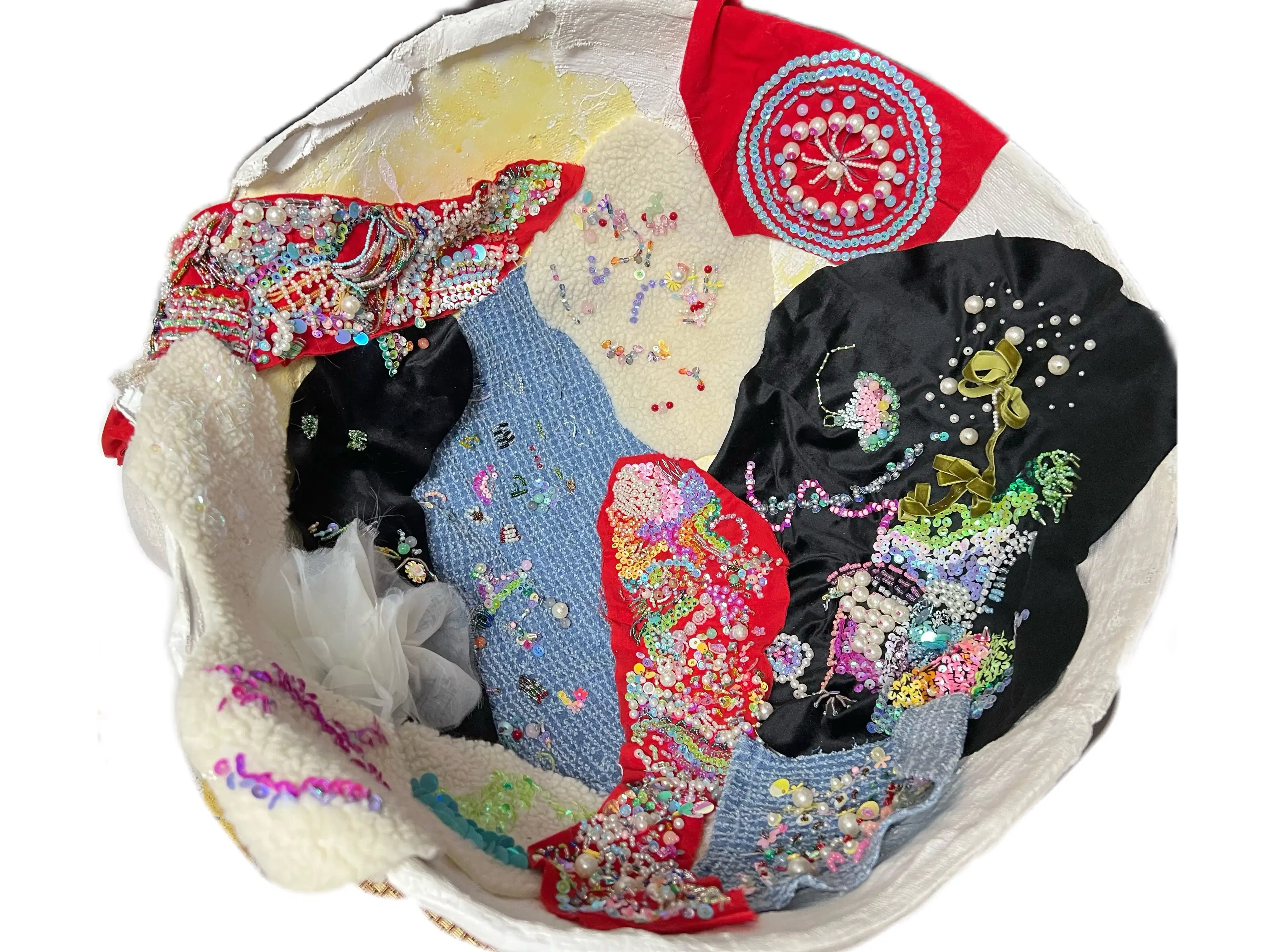 Plaster womb with embroidered and beaded fabric