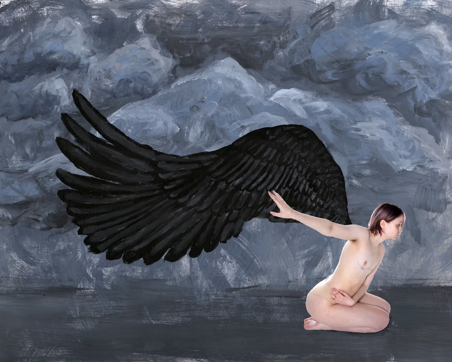 Self-portrait of a person kneeling in a grey painted background with black painted wings. 