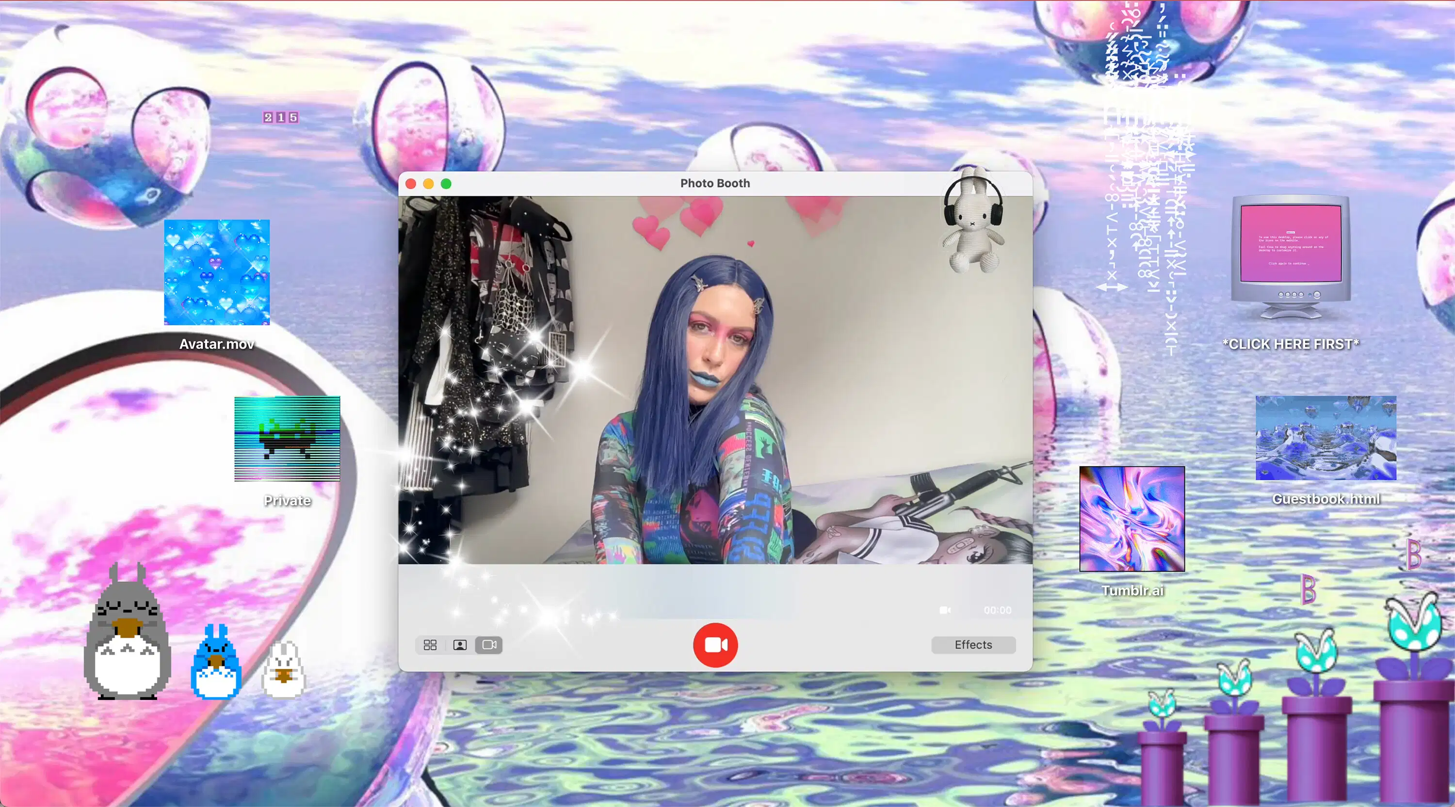 A color still by Gabriela de Cos, dated 2024, of a desktop computer website with a woman with blue hair posing in a photobooth and several icons and gifs.