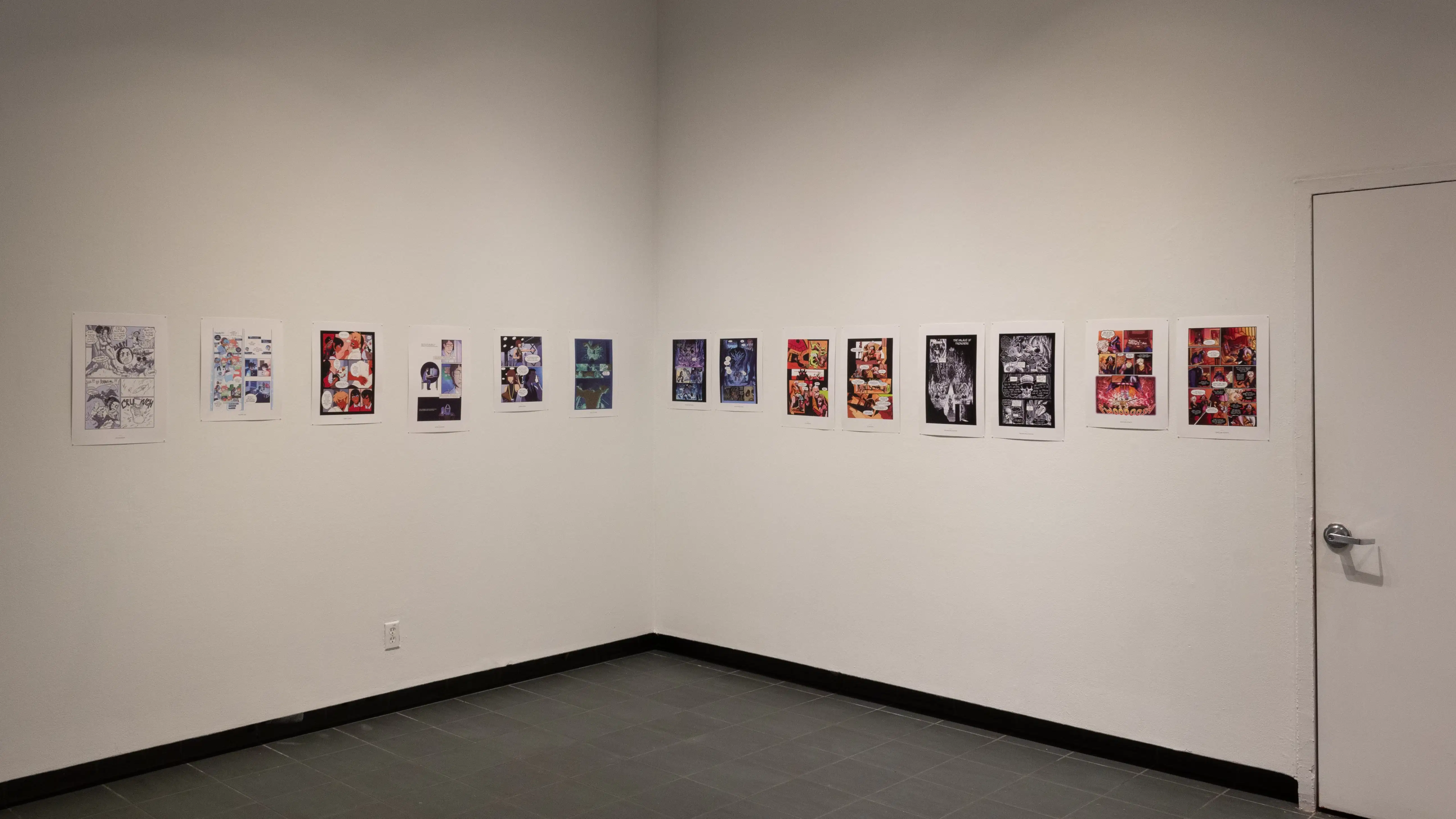Install image showing an angled view of an alcove with a doorway on the right and many prints lining the walls in a row.