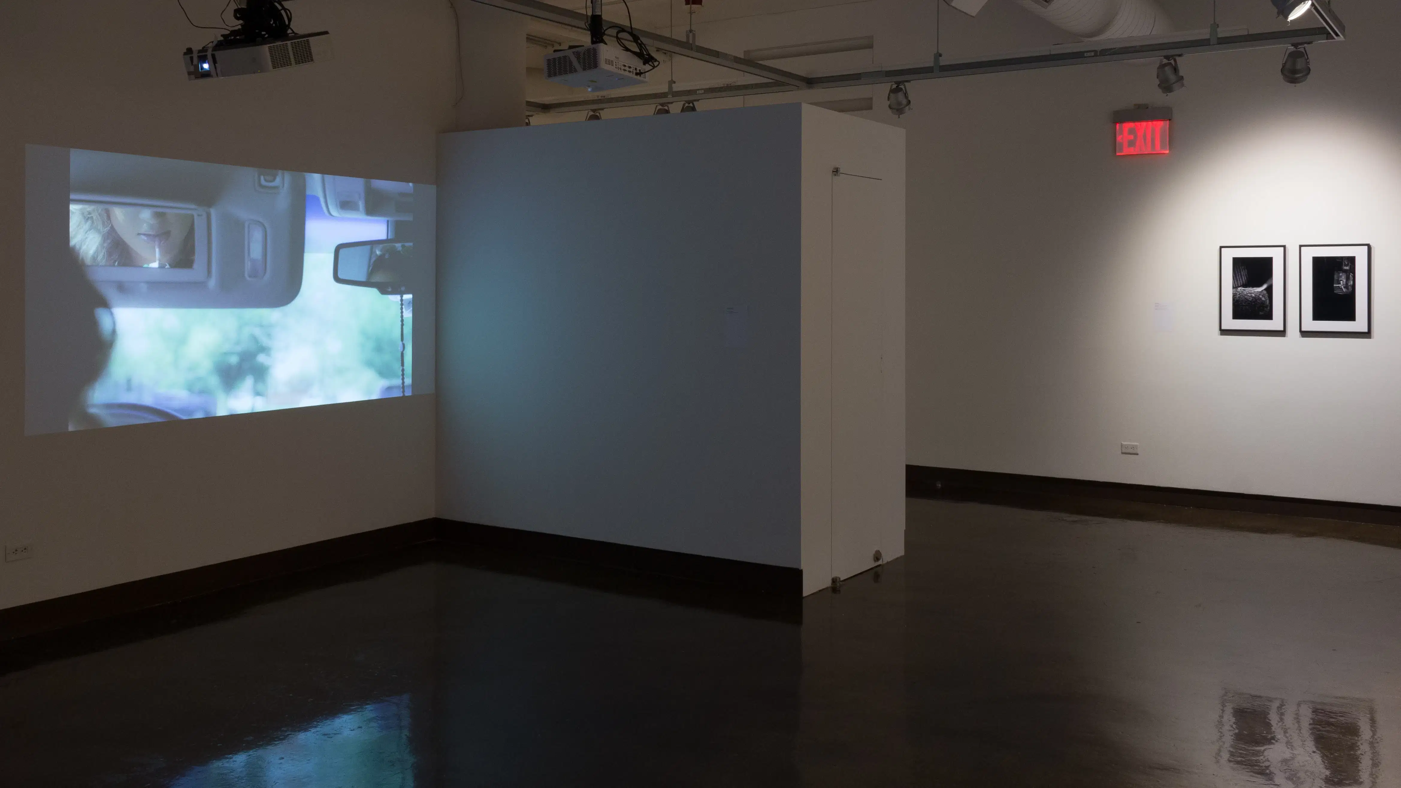 Another angle of gallery three shows one of the projections, and more black and white photographs hung in the right hallway.