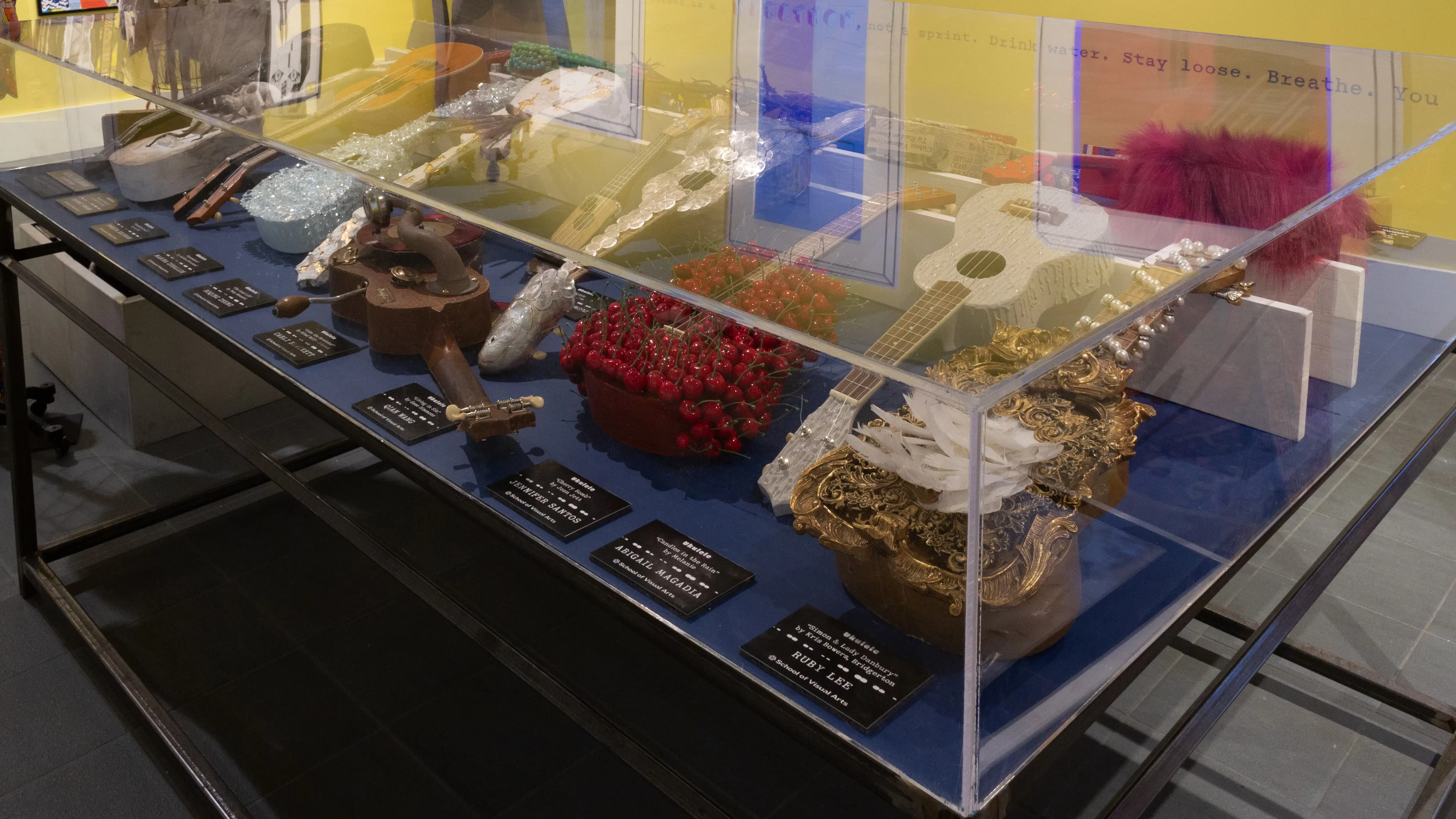  View over the vitrine, where several themed ukuleles can be seen inside.