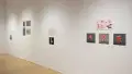 Angled view of four student works, showing four installations of printed mockups of animated characters.