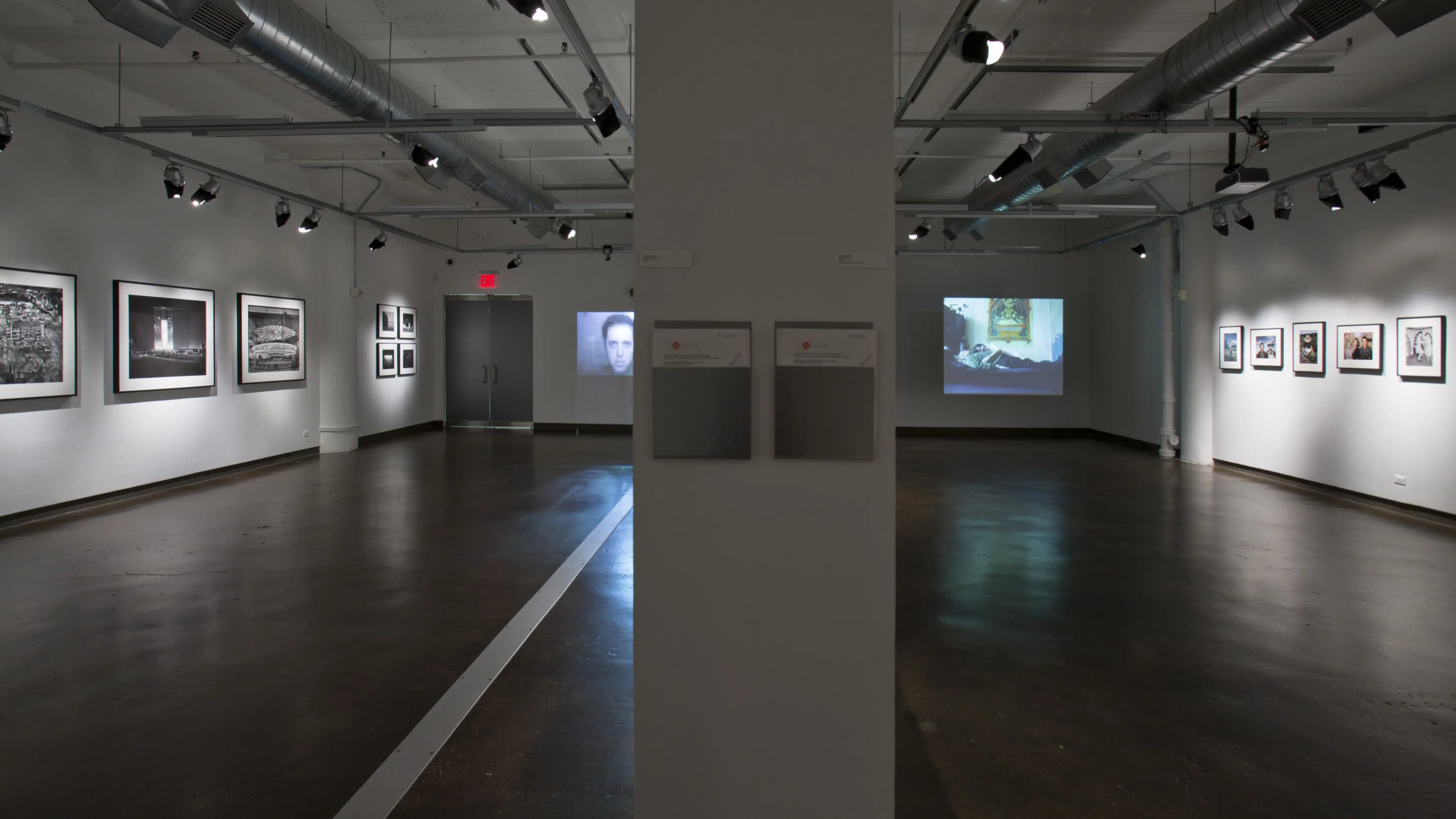 An empty hall with many photos.