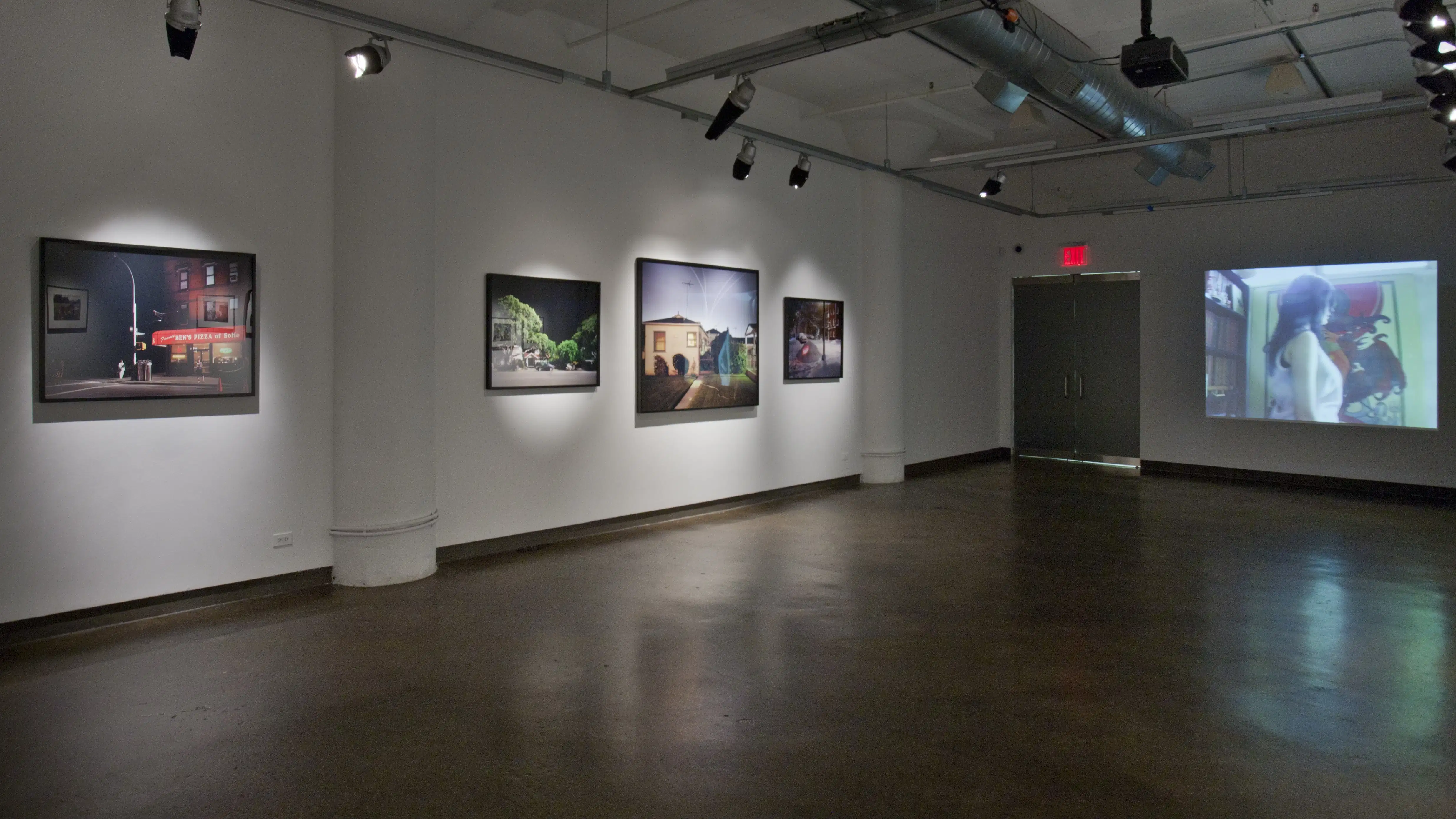 A gallery with pictures and a projection.