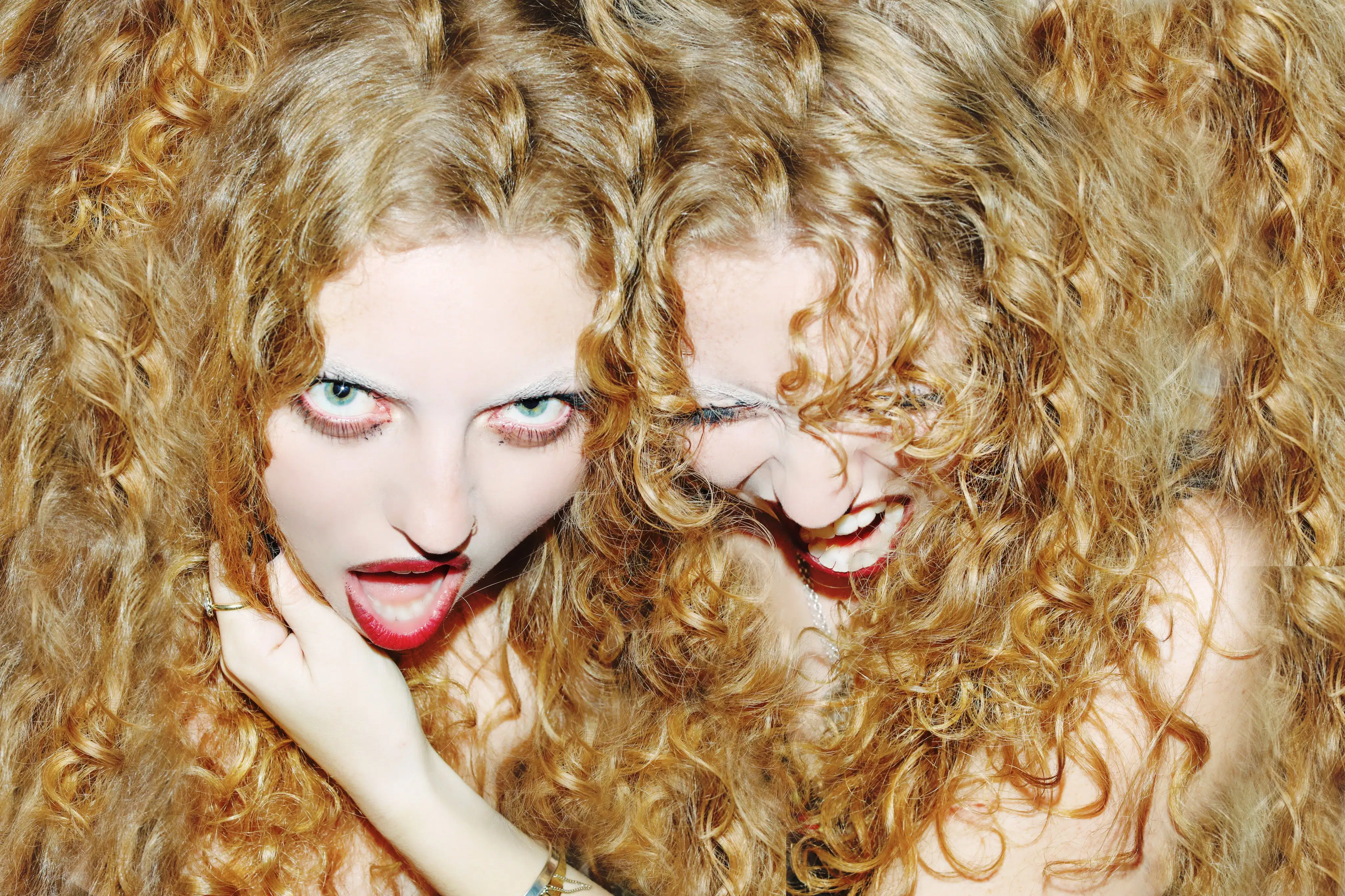 This is an image of my friends who are twins. They have beautiful curly hair and I wanted the image to blend the hair so that it looks like the hair belongs to both girls and that they are attached.