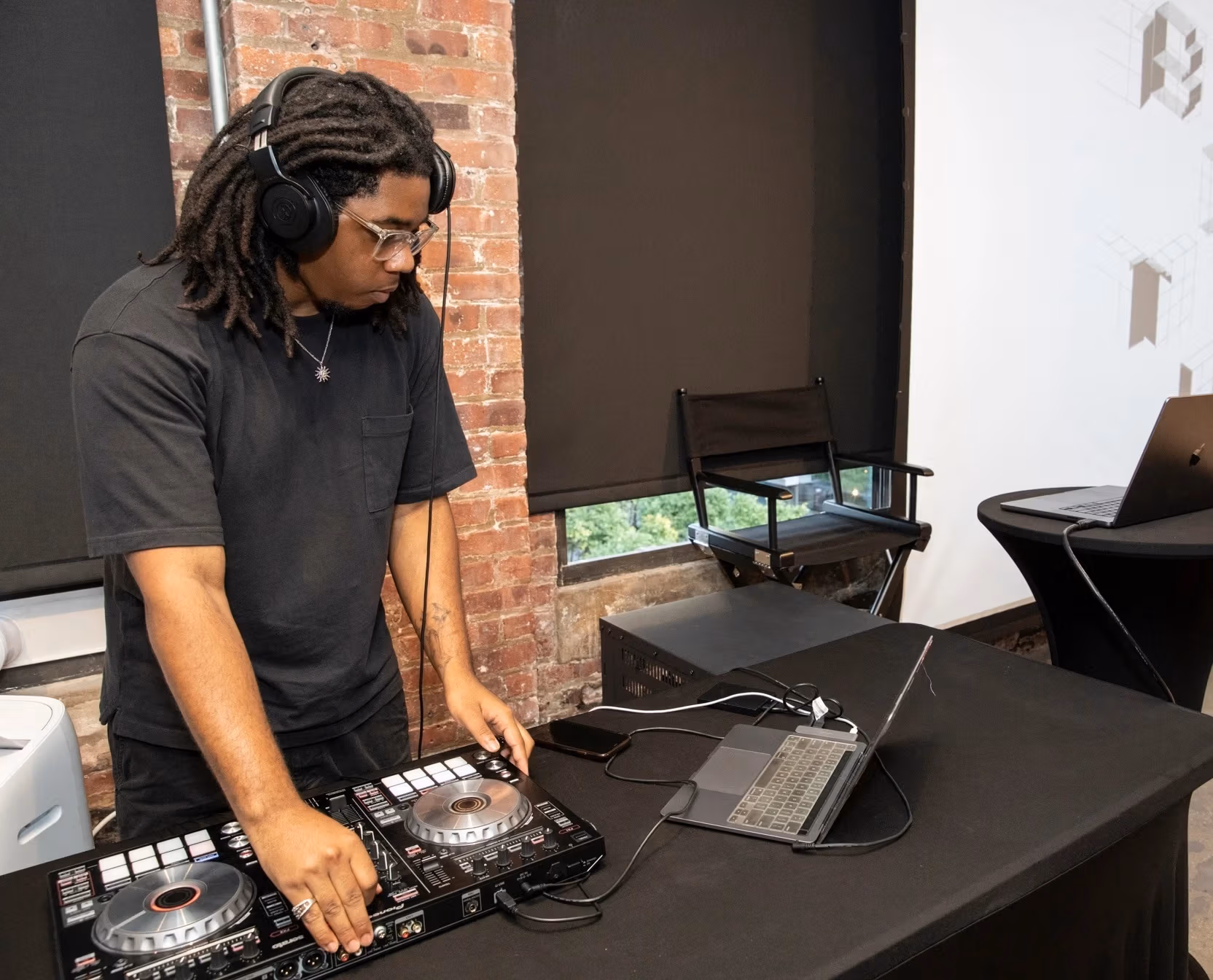A WSVA student DJ spinning jams during a takeover of the One Club for Creativity headquarters.