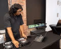A WSVA student DJ spinning jams during a takeover of the One Club for Creativity headquarters.