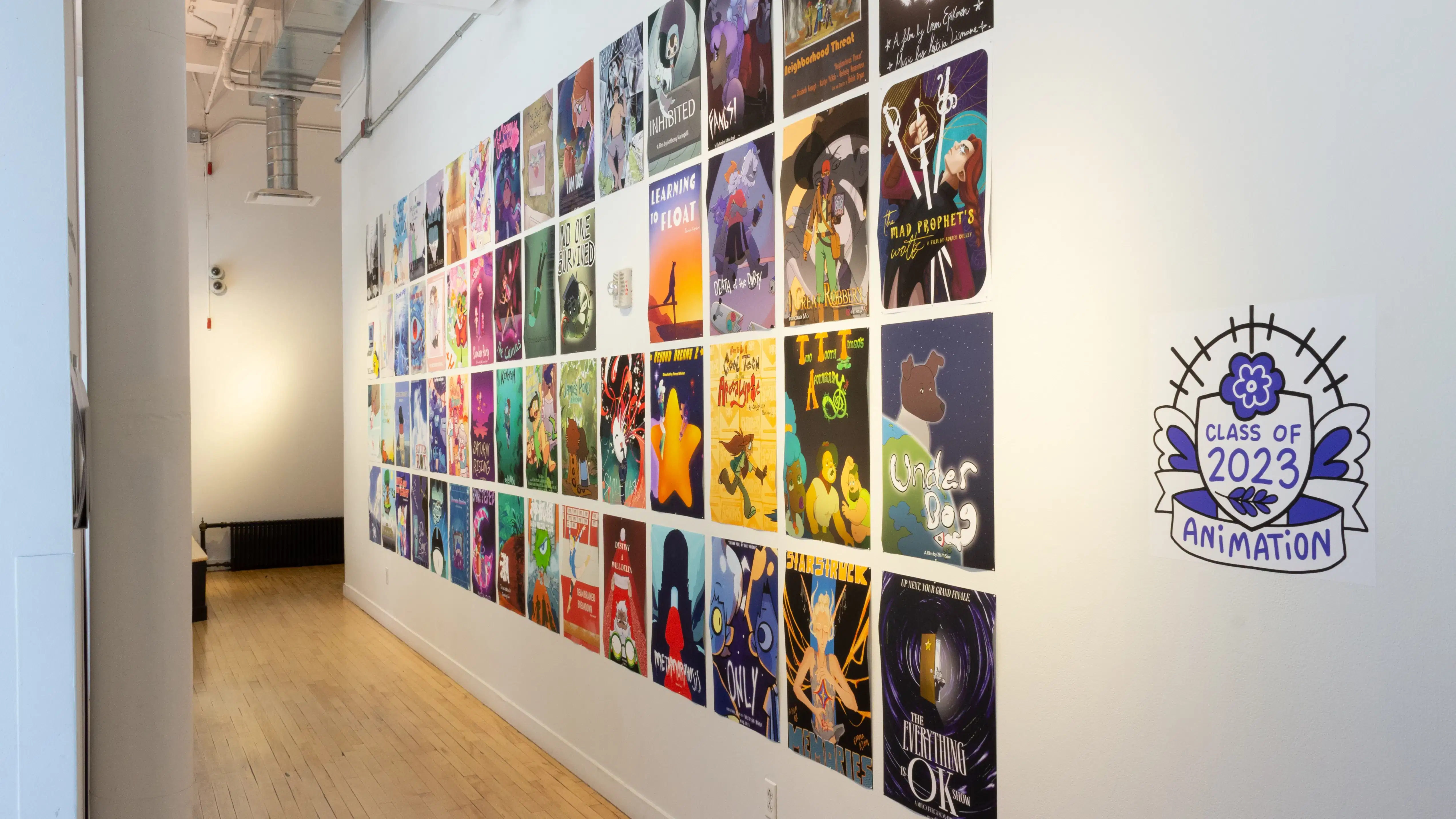 Installation image showing a hall lined with posters.