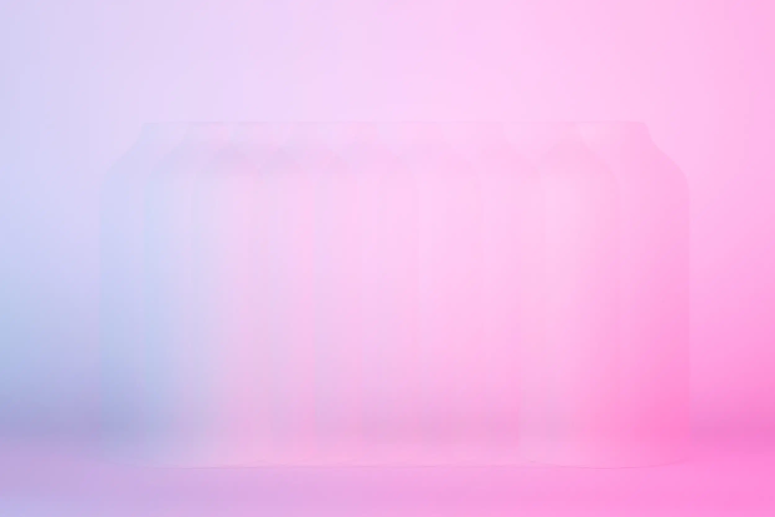 A vase on a white backdrop that is lit by a blue light and a magenta light