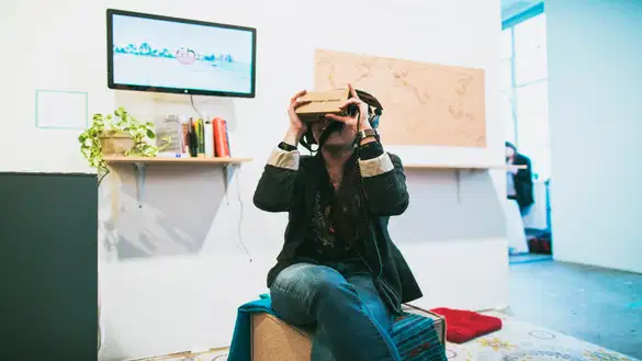 person looking through a vr box