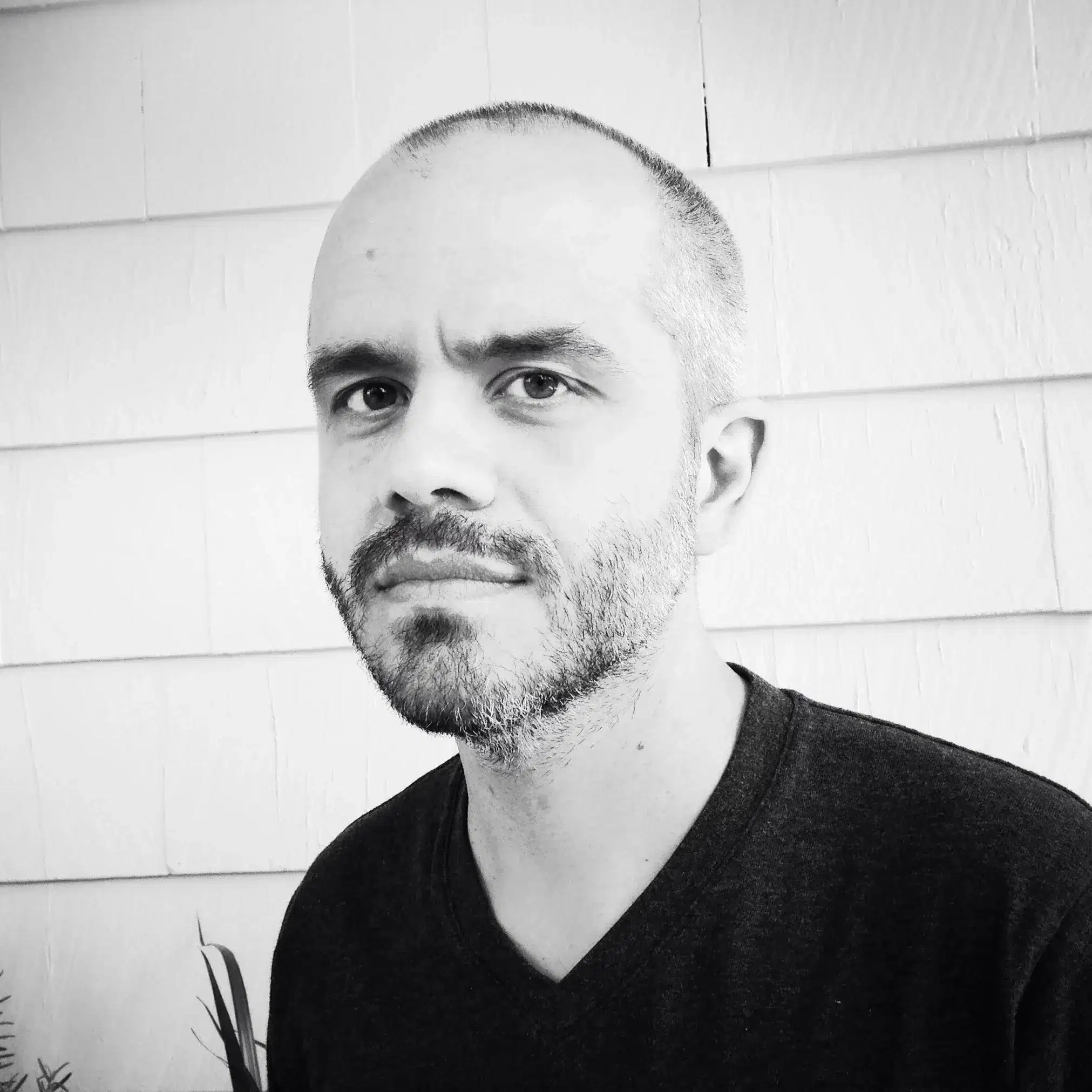 Black and white photo of a person looking at the camera.