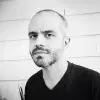 Black and white photo of a person looking at the camera.