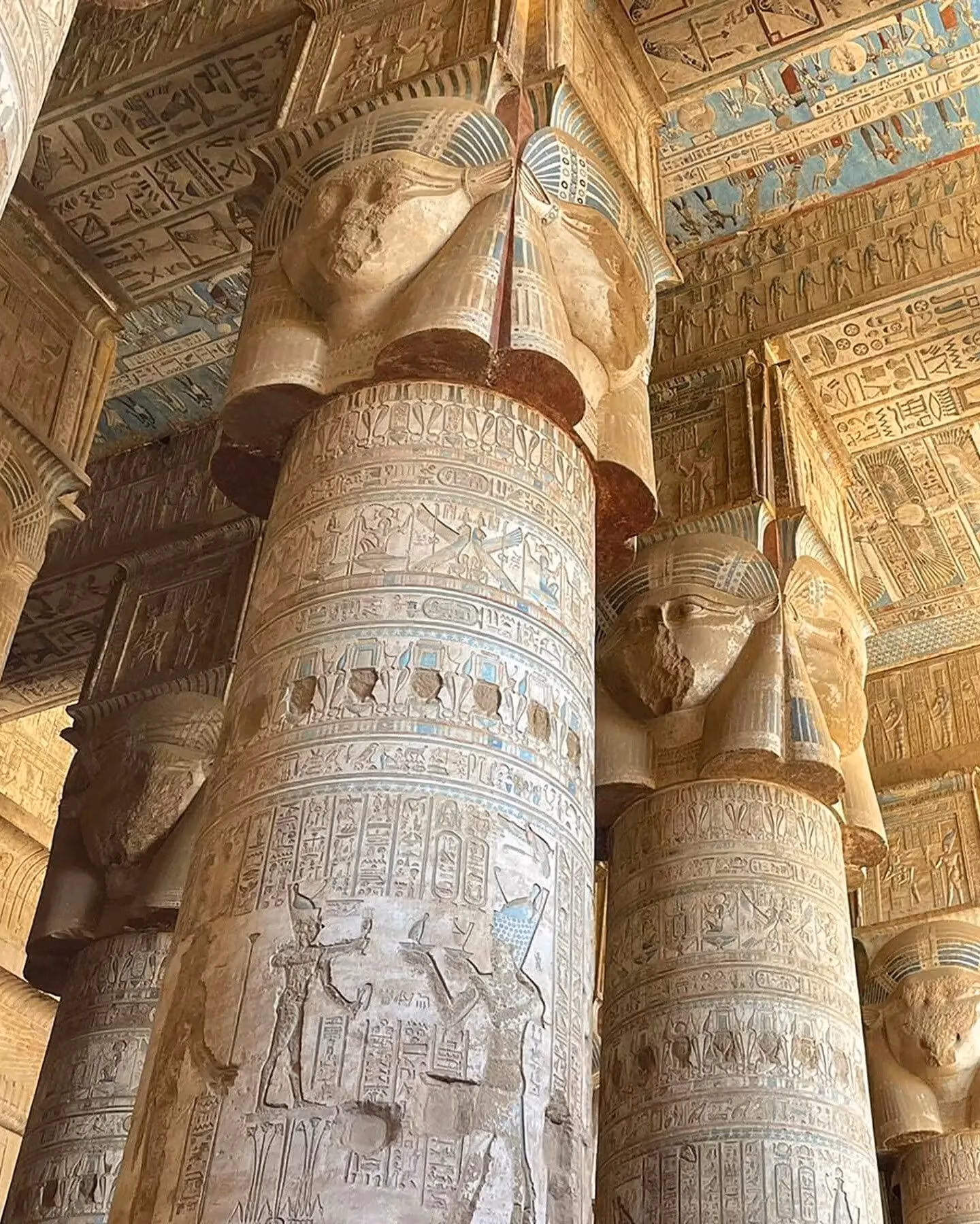 Pilars filled with detailed and ornate hieroglyphics in buildings in ancient Egypt. 