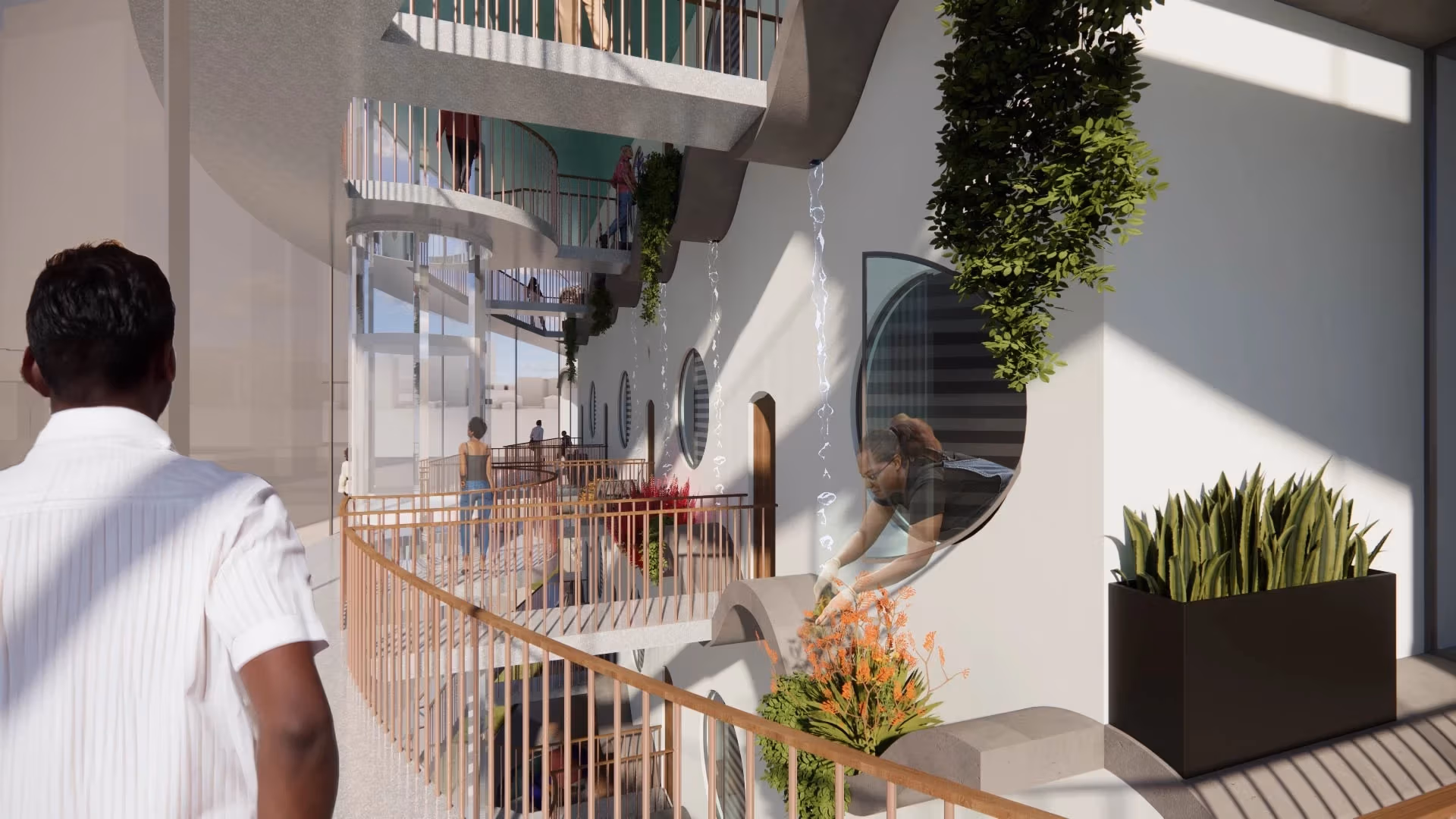 A man in a white shirt looks on at a courtyard within a housing complex.