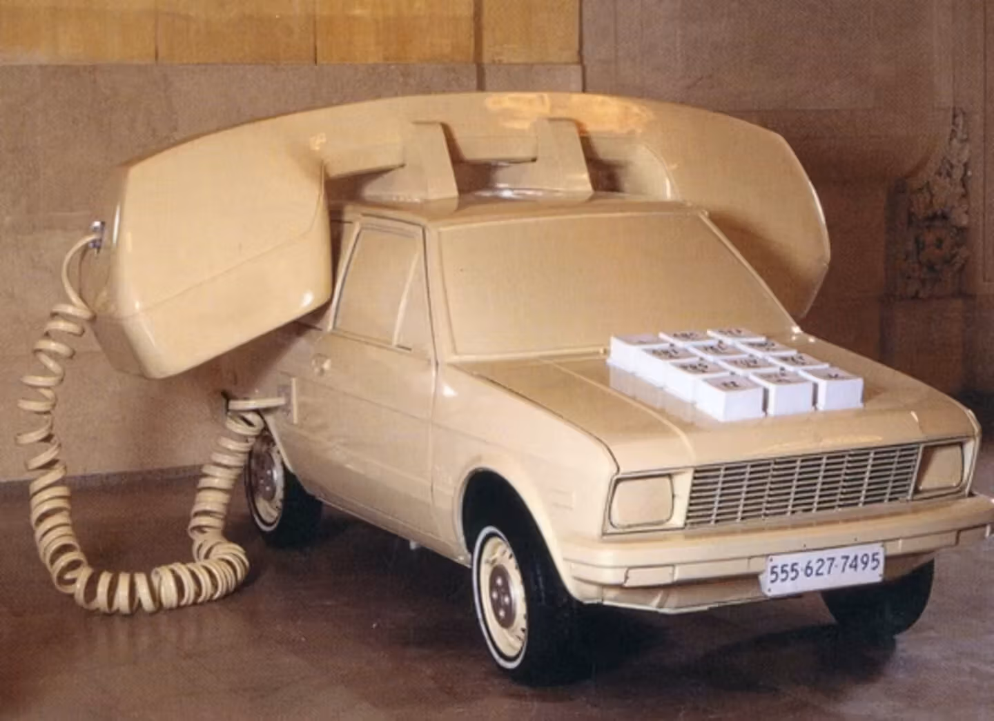 An upcycled Yugo vehicle turned giant telephone sculpture. 