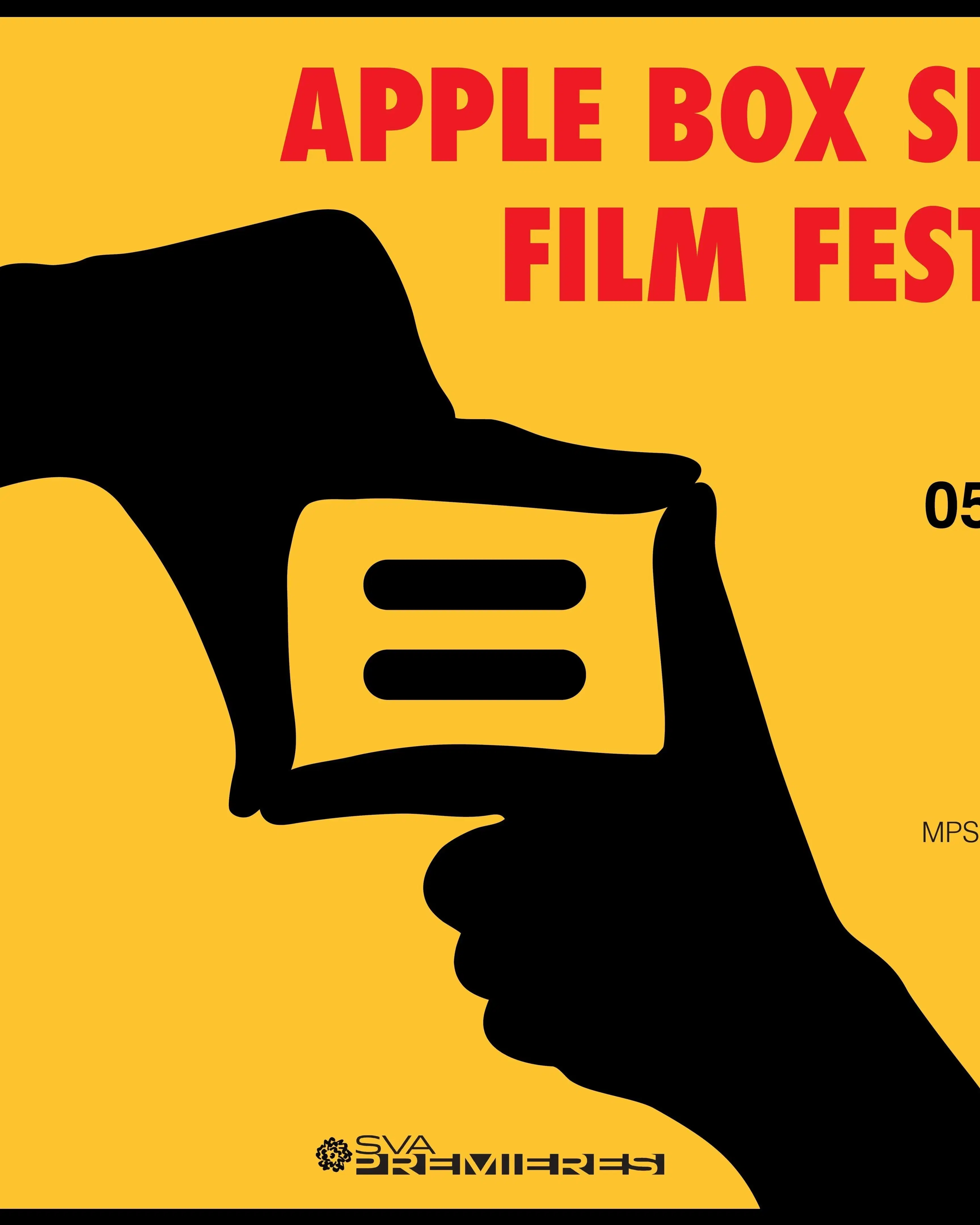 A promotional poster: the silhouette of two black hands mimicking the frame of a camera, on a bright yellow background with the words “Apple Box Short Film Festival” in bright red.