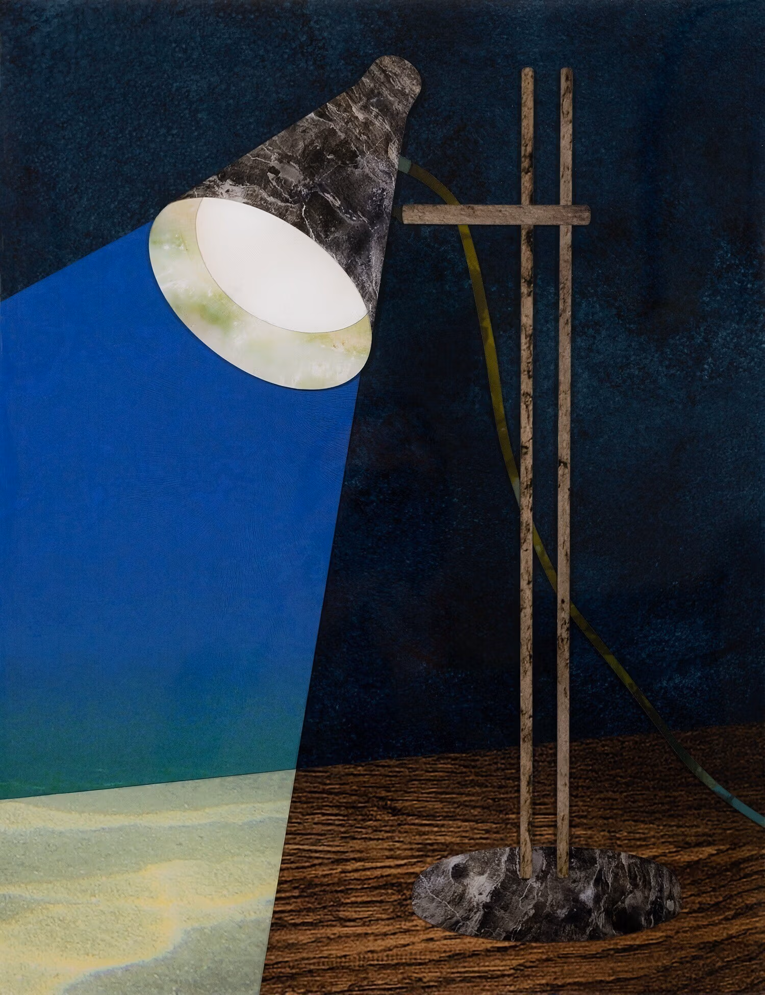 A desk lamp sits on a wooden desktop and shines a light that shows a blue background and a lighter, sand-colored desk.