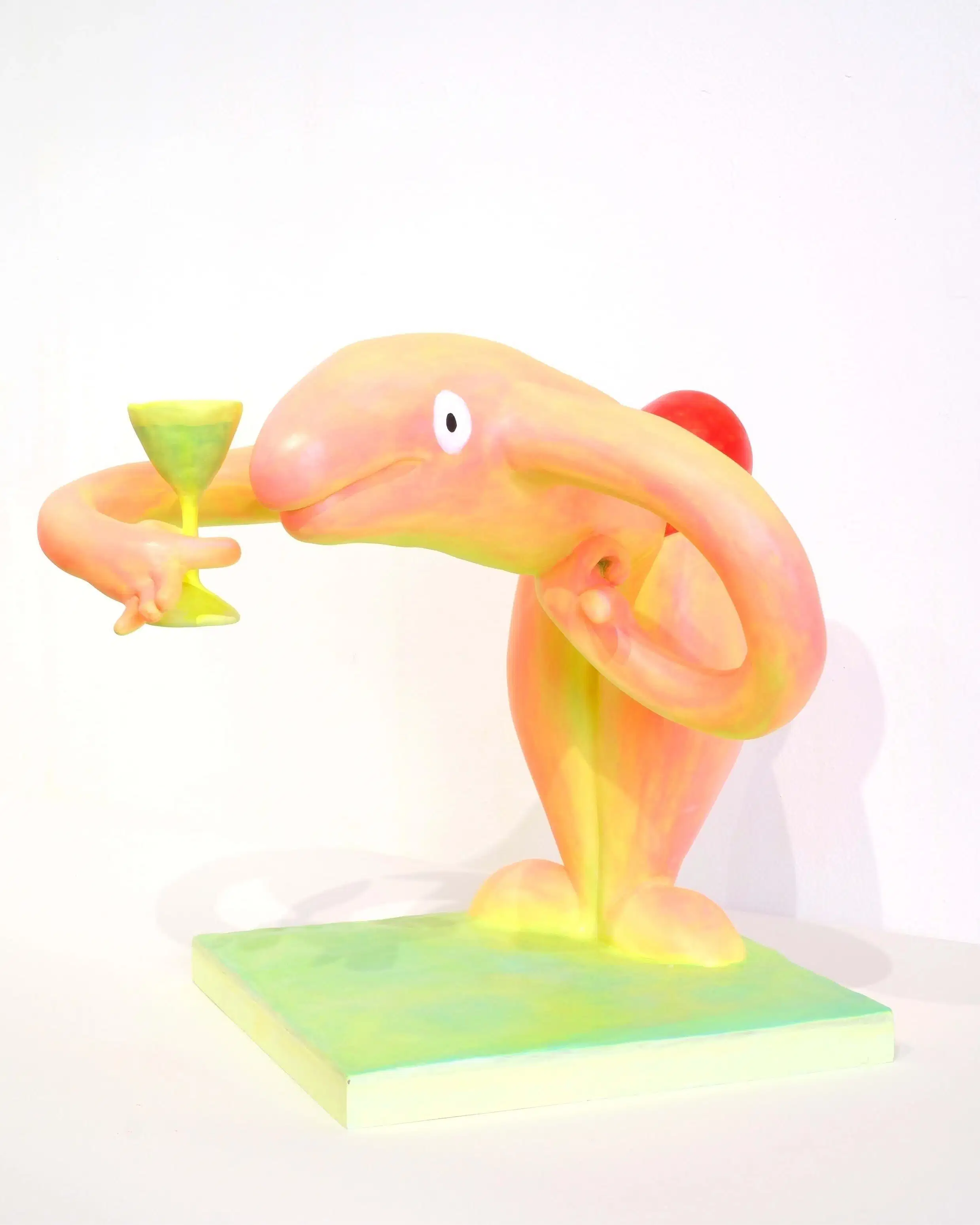 Diptych sculpture showing two anthropomorphic creatures in swim suits drinking cocktails and preparing to dive.