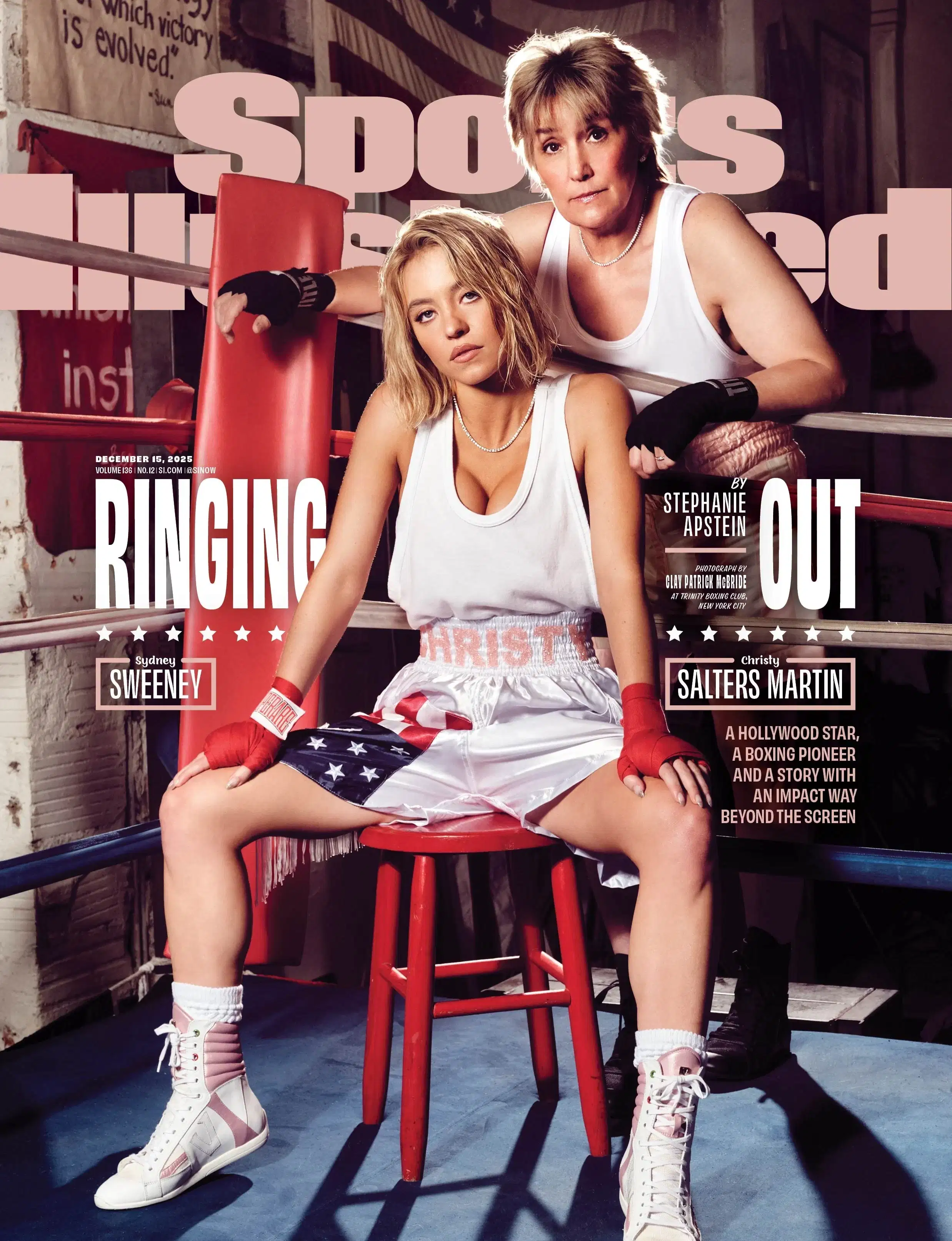 Two people in a boxing ring, both wearing white tank tops. One sits on a red stool, looking confident; the other leans on the ropes, conveying strength.
