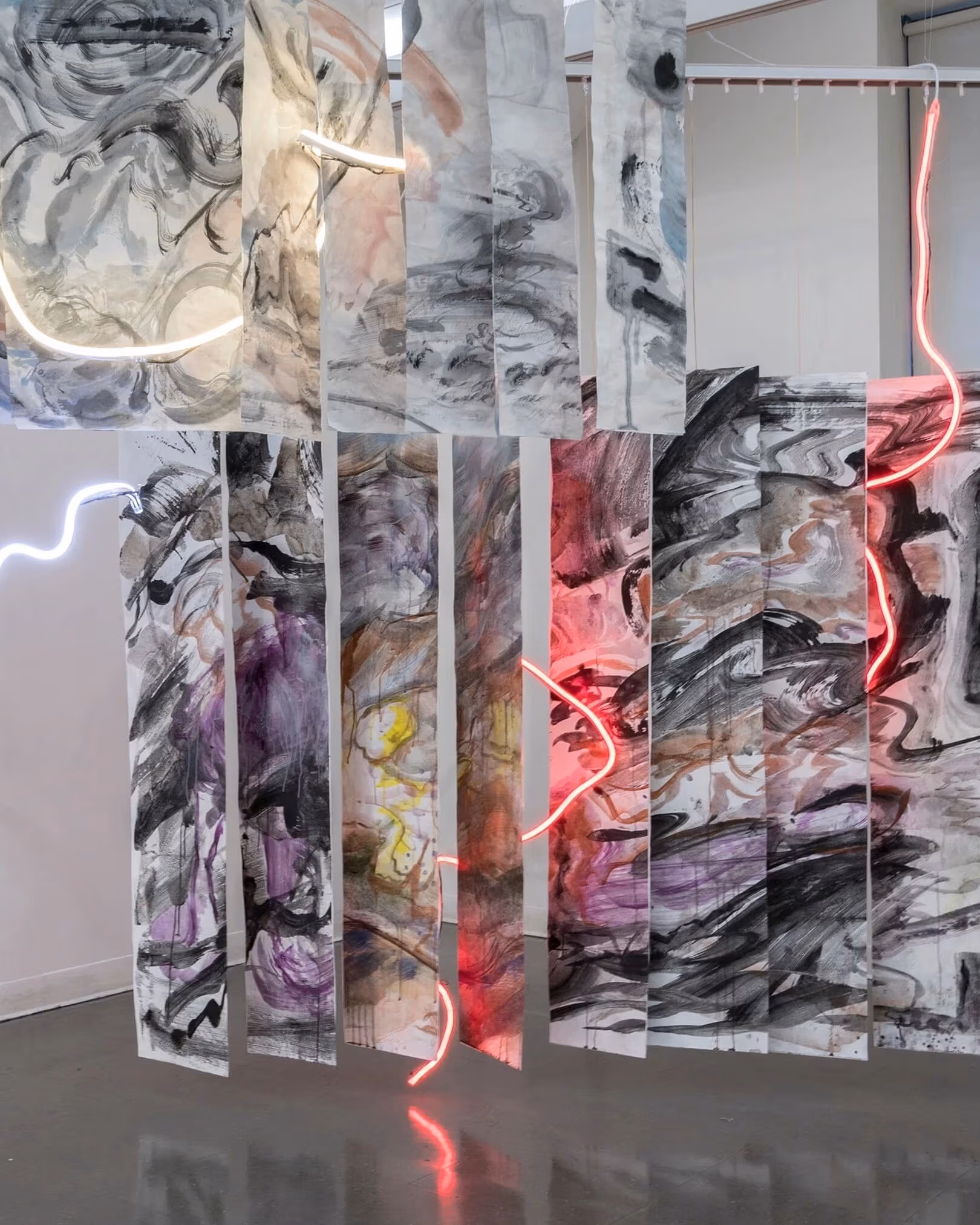 Painted panels with freeform neon stringed lights weaved throughout