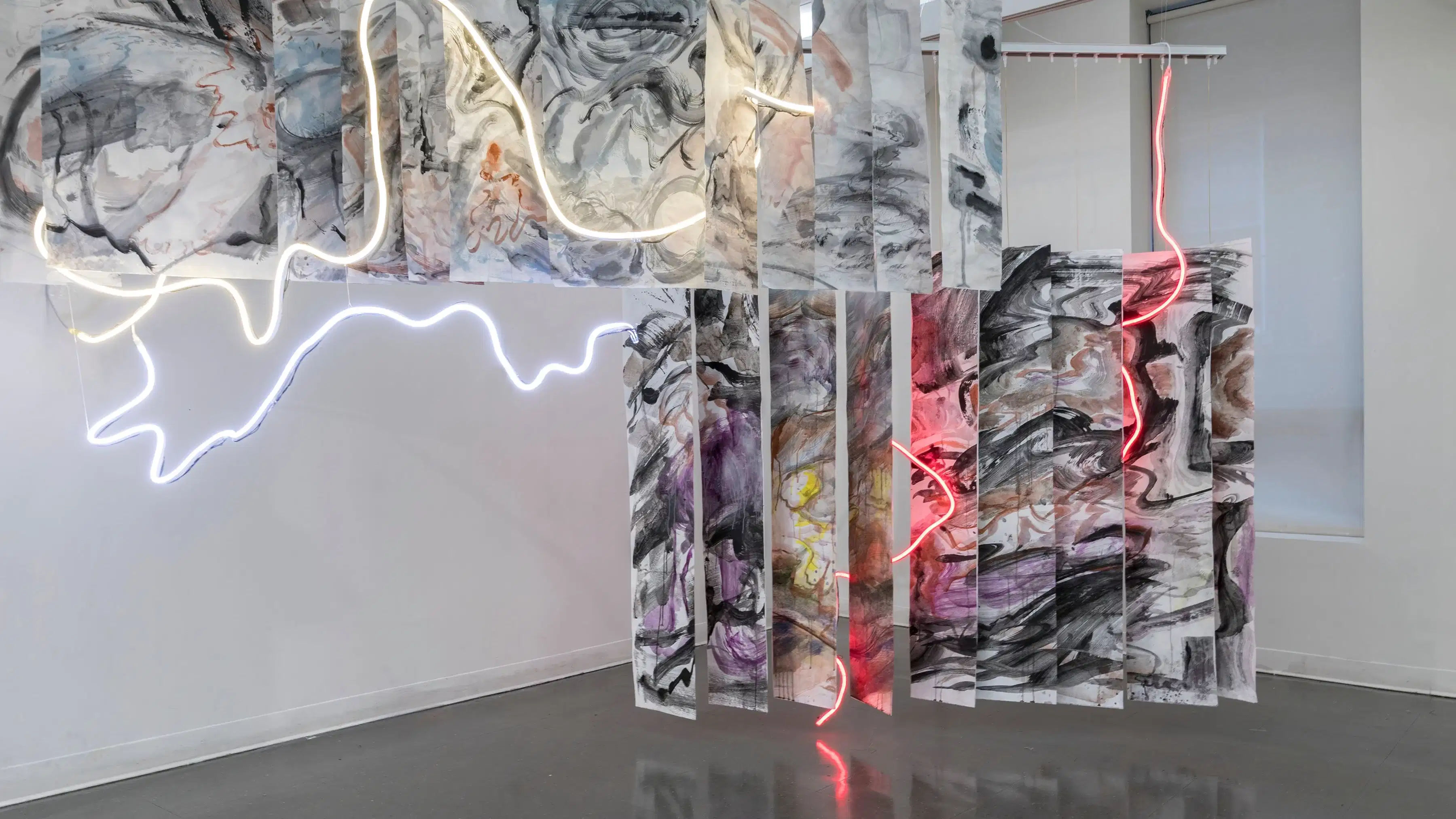 Painted panels with freeform neon stringed lights weaved throughout