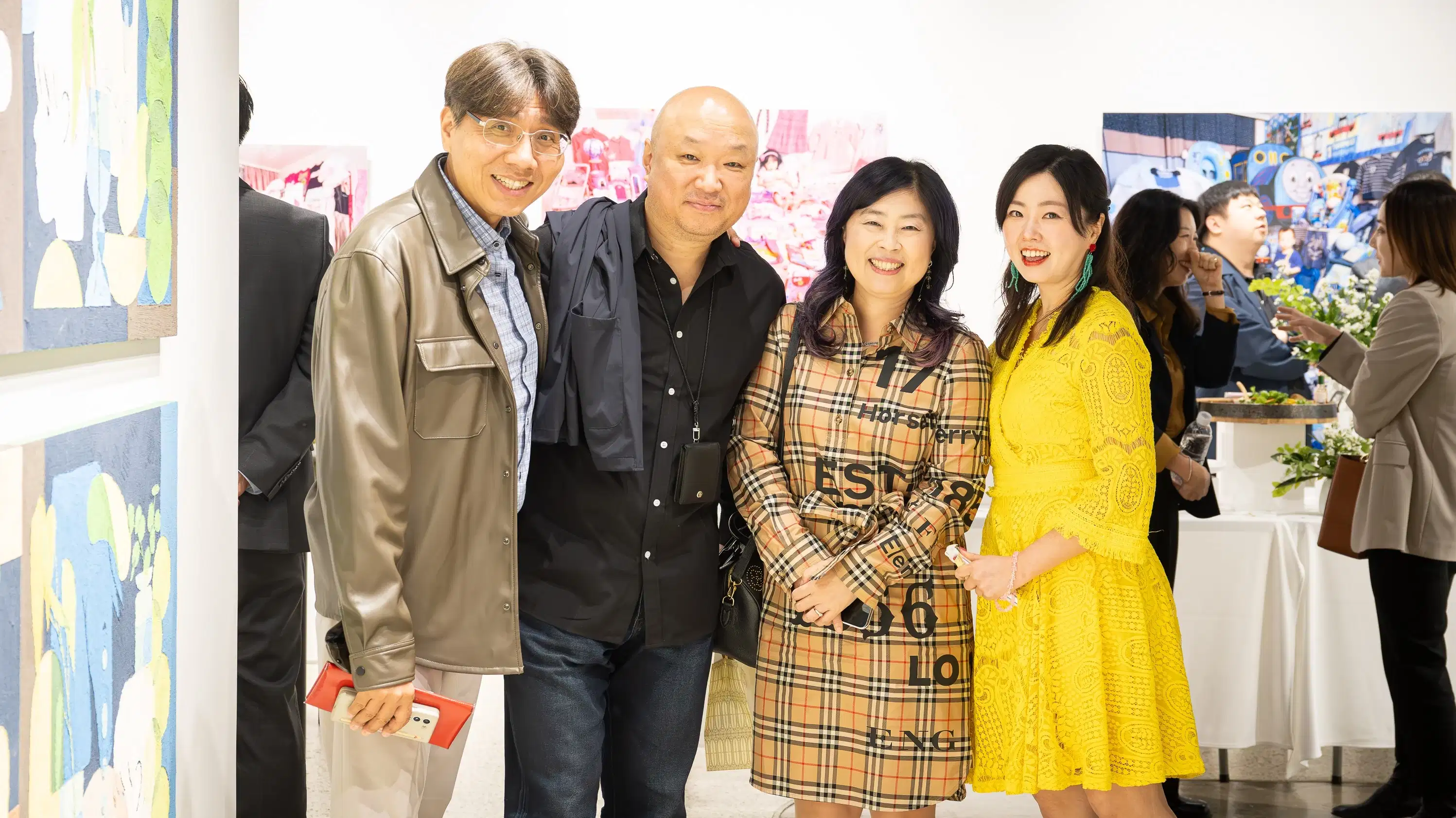 A group of people pose for a photo in SVA's Andrew Chang Gallery in Seoul.
