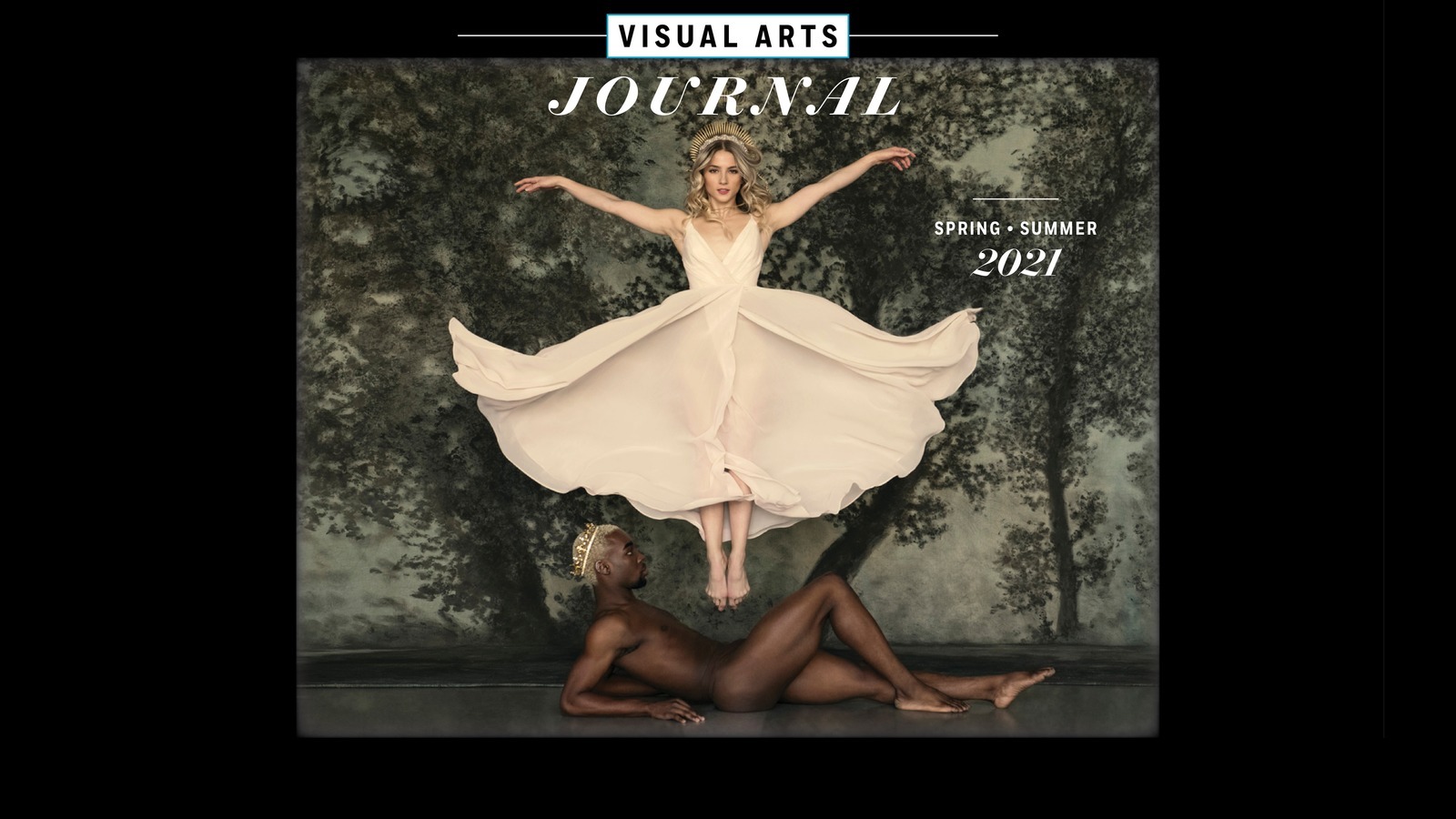 A photograph of two dancers—one lying on the ground and the other midair with arms outstretched.