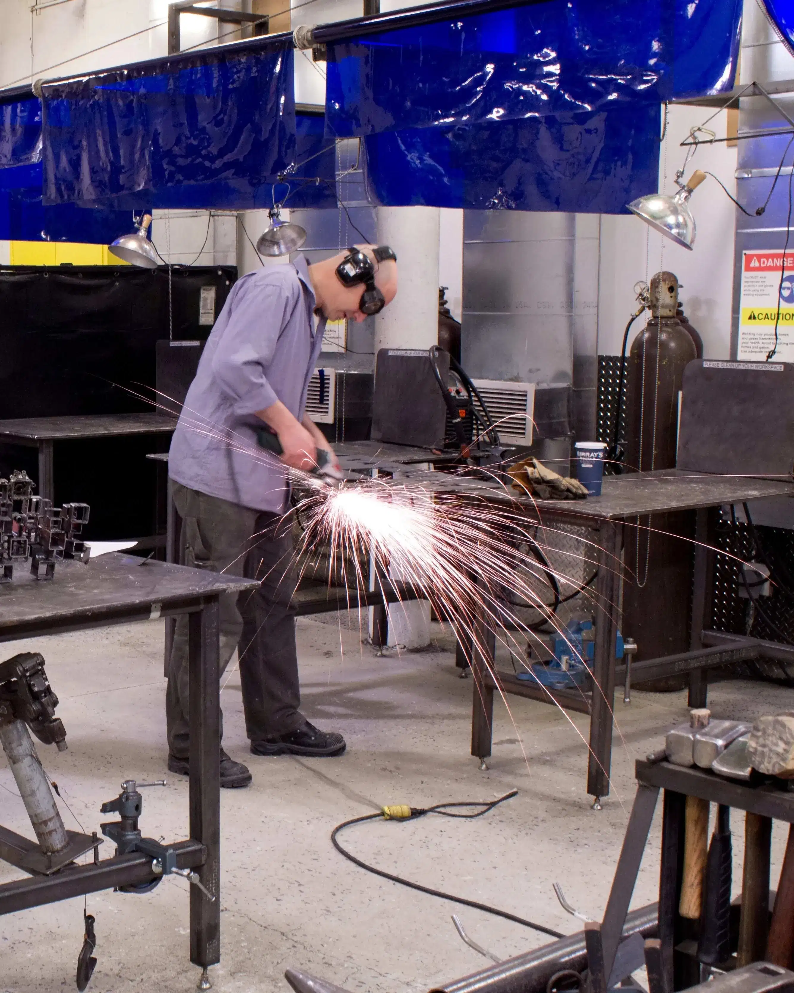Artists working in the metal shop at SVA. 