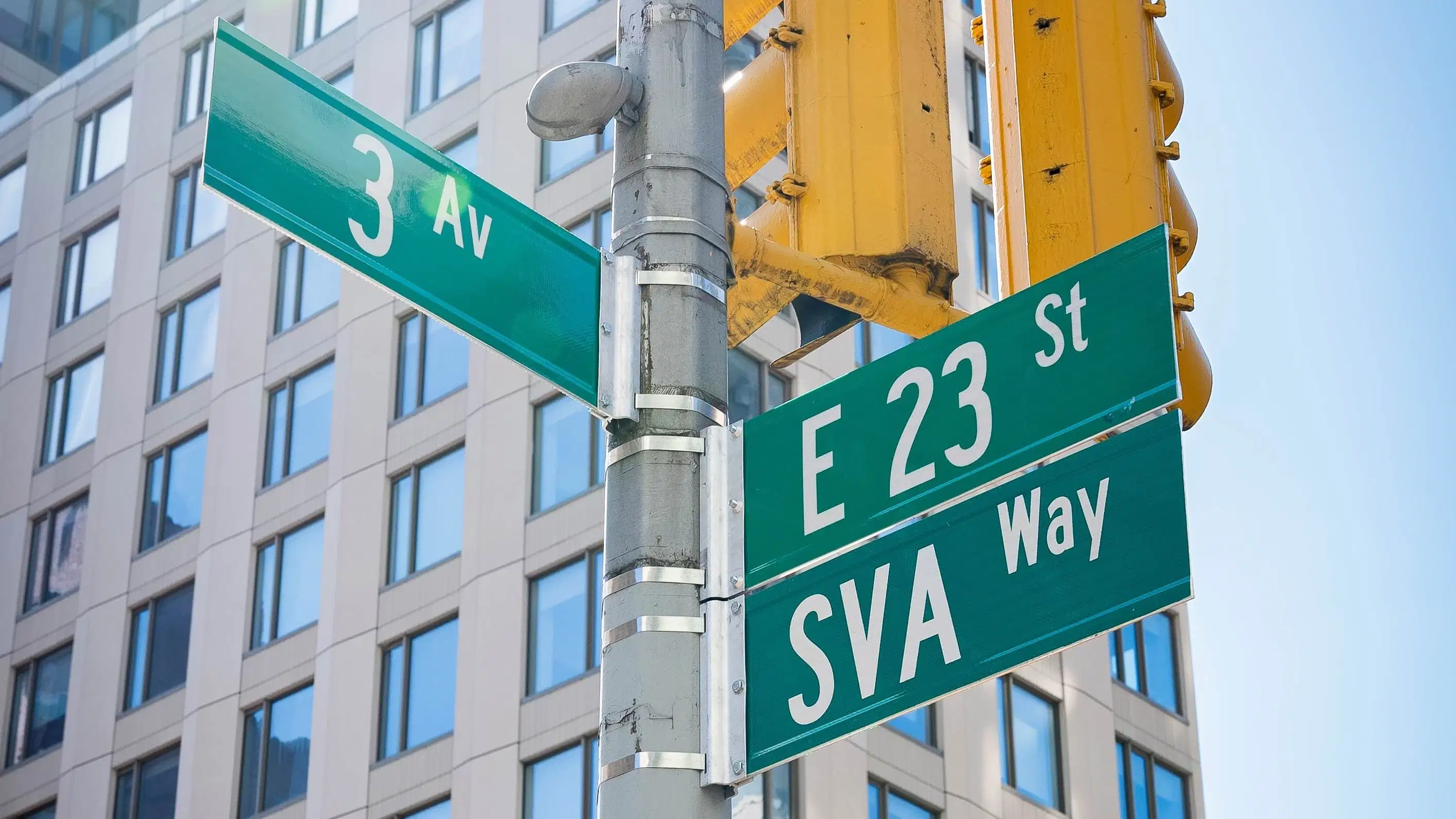 NYC cross street on the corner of 23rd St. and 3rd Ave., with newly installed “SVA Way” co-naming street sign by DOT