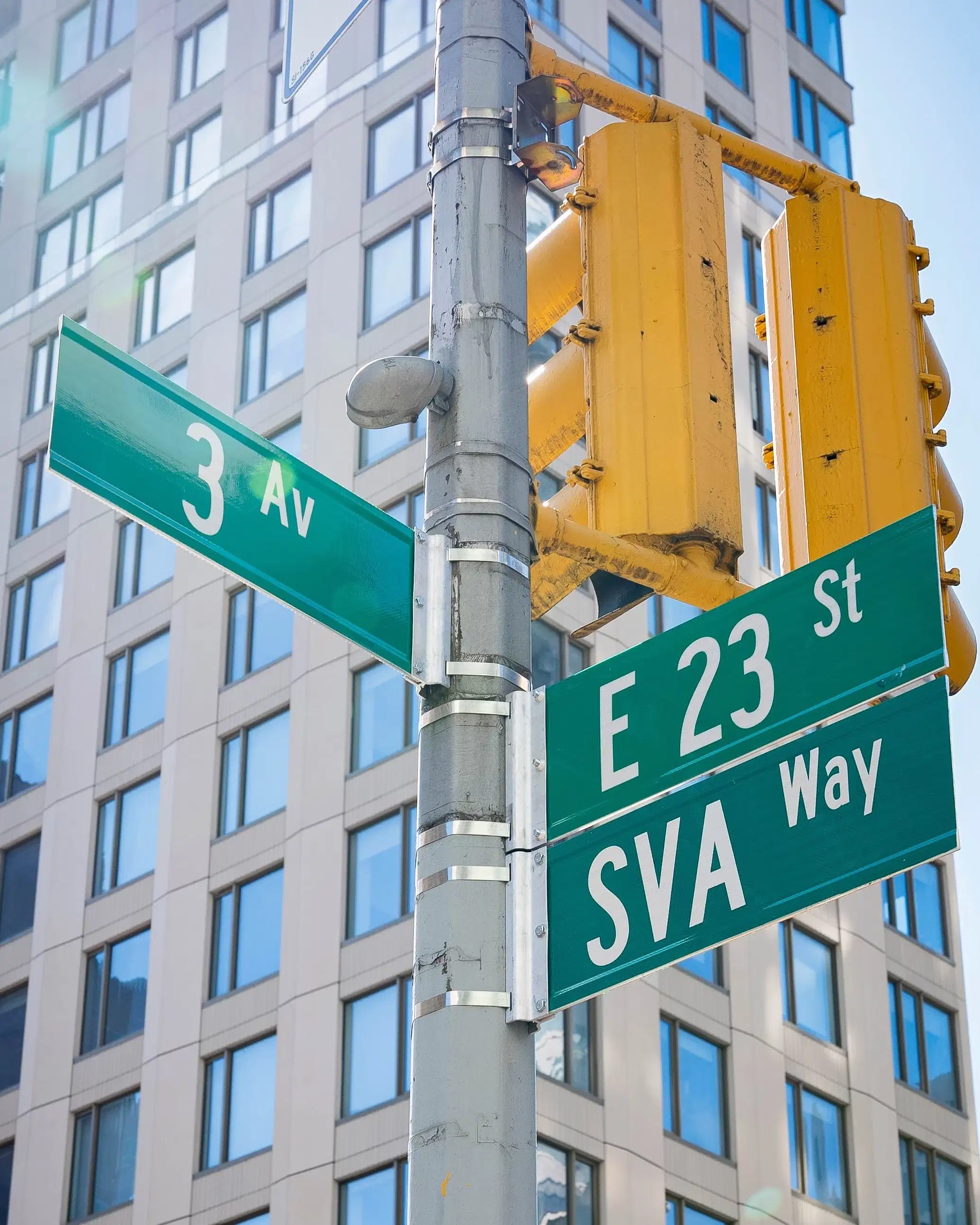 NYC cross street on the corner of 23rd St. and 3rd Ave., with newly installed “SVA Way” co-naming street sign by DOT