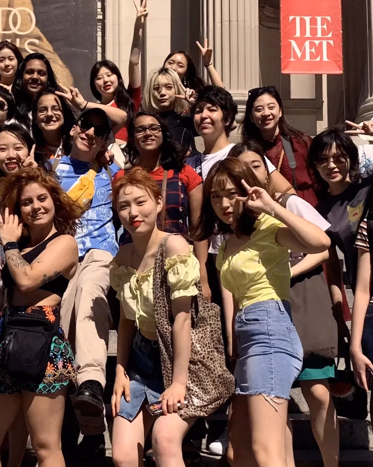 Students pose for a group photo on the iconic steps in front of the Metropolitan Museum of Art.