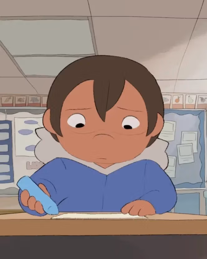 A drawing of a boy sitting at a brown desk. He is drawing with a blue crayon.