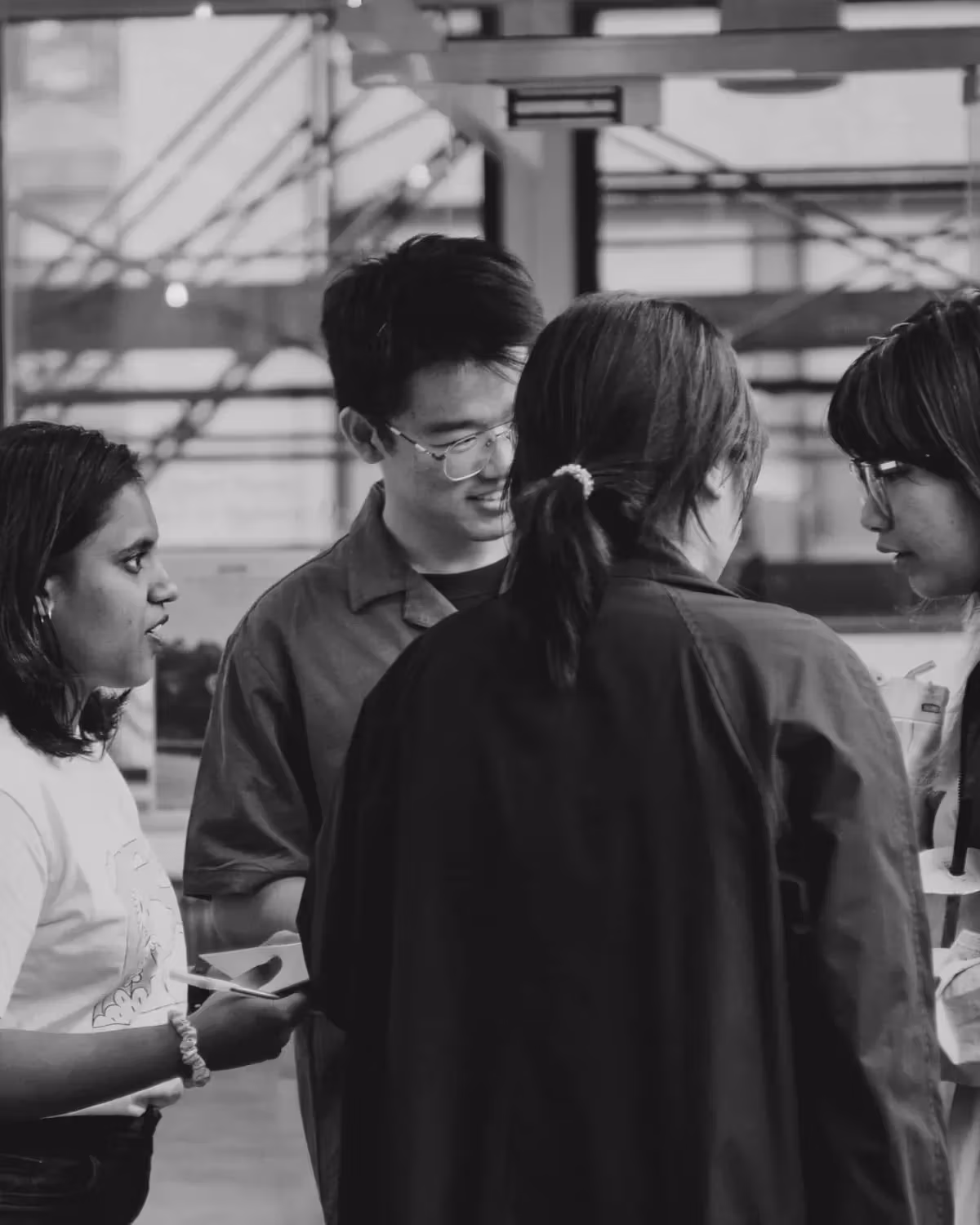 Black and white photo of students collaborating
